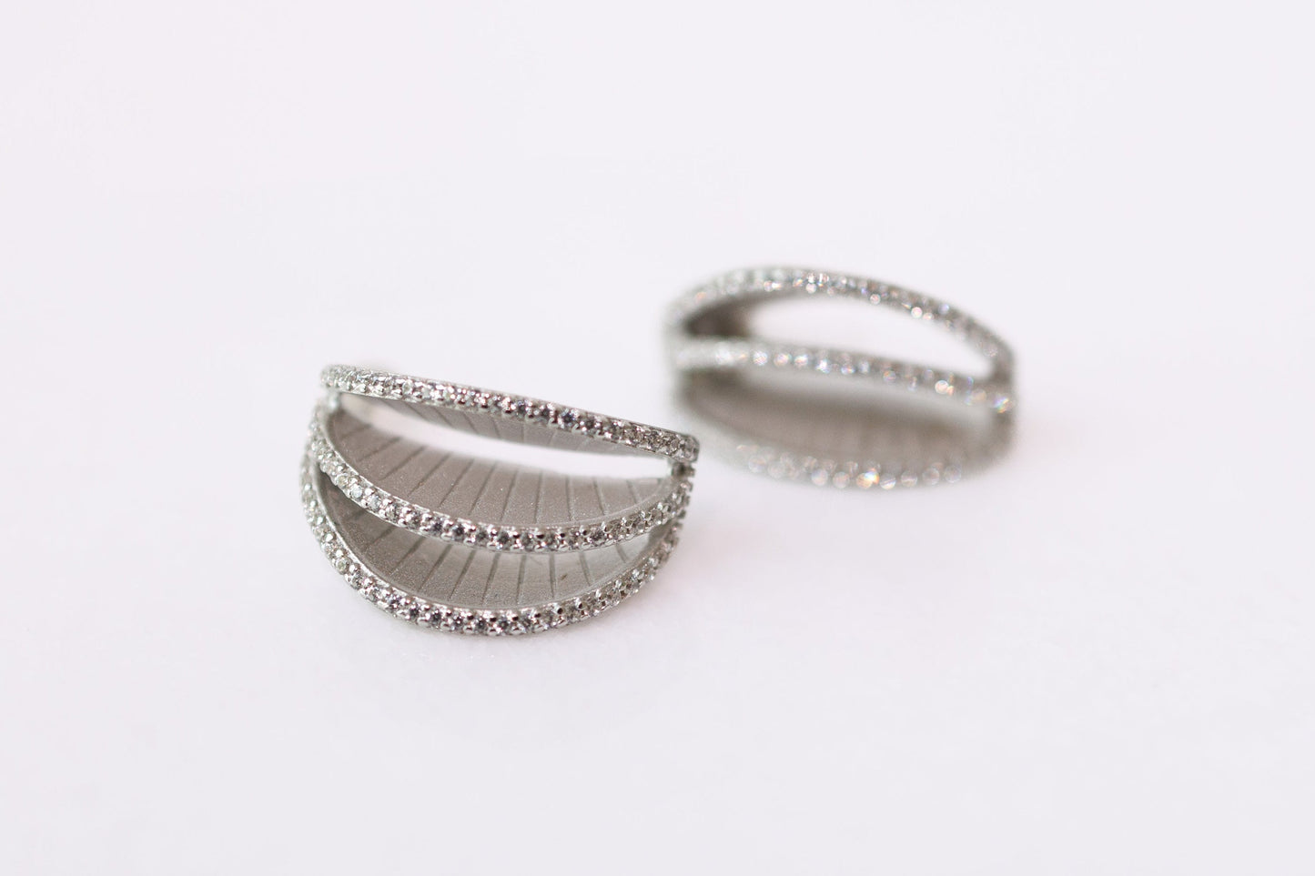 Two silver rings on a white background