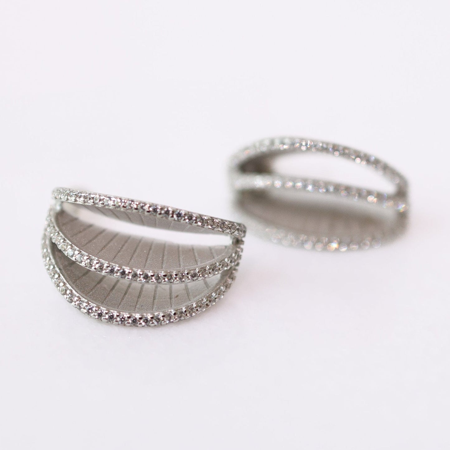 Two silver rings on a white background