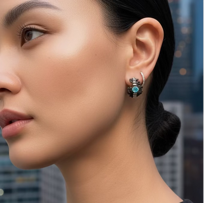 Woman wearing earrings with a cityscape background