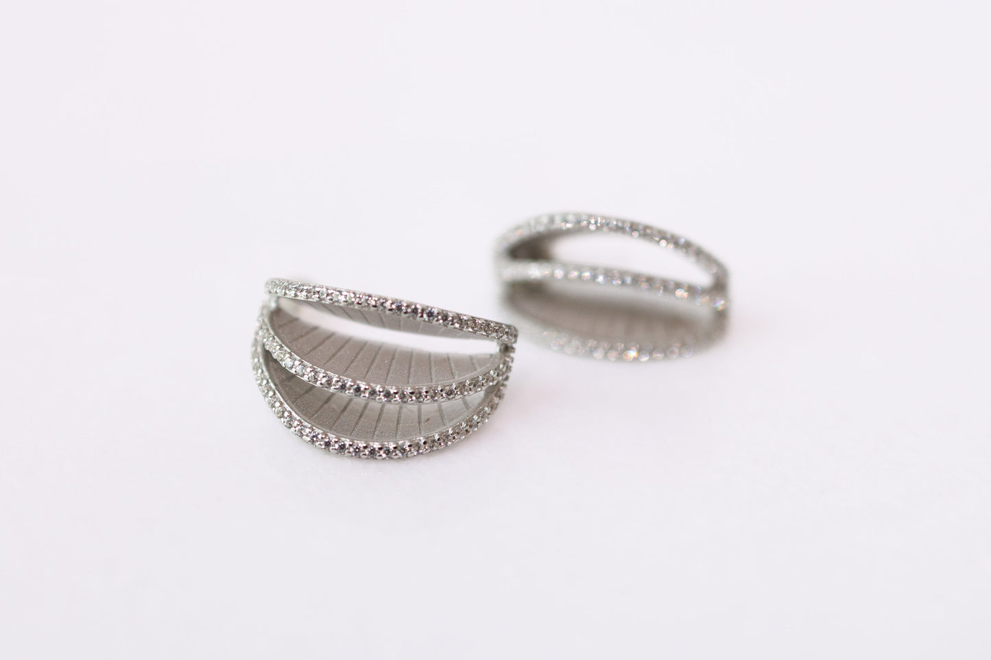 Two silver rings on a white background